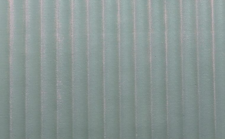 Ripple Stone flexible clay cladding — soft vertical corrugation, six tones