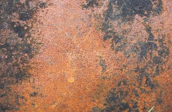 Rust flexible clay cladding — weathered corten, twelve faces, no repeat